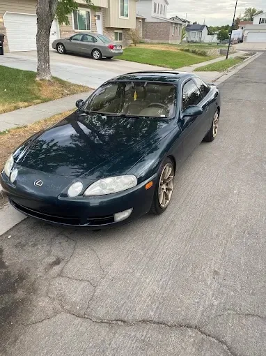 Dark green Lexus SC coupe with polished paint after a mobile detail